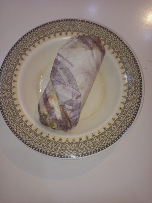 Grilled Cheese Shawarma by First Bite Fast Food was served to WordPress freelancer via Foodpanda on Tuesday, 20 February 2024, at The e-Earn PITB Co-Workspace Faisalabad.